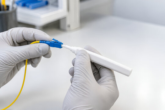 Technician Cleaning a Fiber Optic Connector with a One-Click Pen Before Network Installation