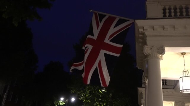 Union Jack waving outside a house in the evening