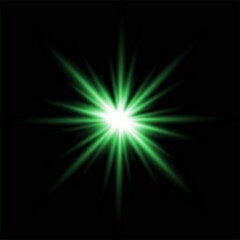 Bright green starburst light effect with glowing rays isolated on a solid black background © jharna