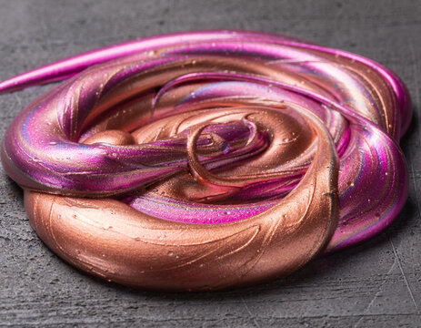 Macro Swirled Viscous Metallic Copper and Magenta Fluid Slime