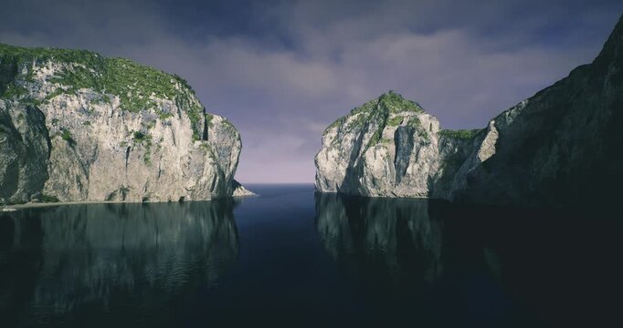 Sunrise cliffs glowing over still water, warm light kissing limestone faces and green patches, narrow channel opening to distant sea, soft reflections