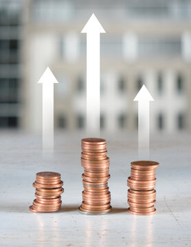 Stack of coins with up arrow, concept for wealth management,finance, bank, increasing interest rate and making money