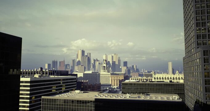 industrial skyline under brooding clouds, layered rooftops with vents and chimneys, muted color palette, heavy atmosphere conveying resilience and urban grit