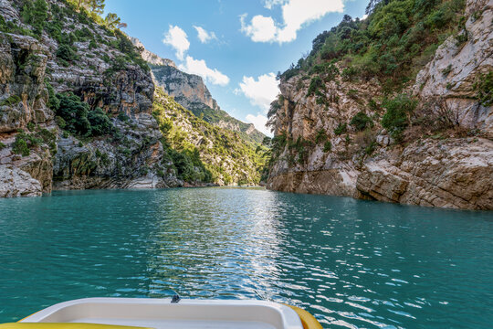 Boat trip on turquoise water of mountain canyon, Verdon Gorge in french Alps, Provence France.