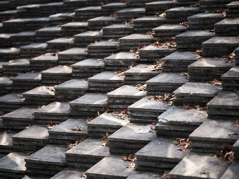 Diagonal pattern of stepped stone blocks with fallen dry leaves Seoul