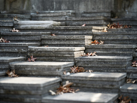 Stone terrace steps covered with fallen dry leaves close-up Seoul
