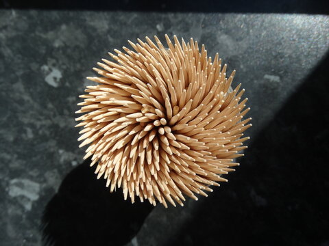toothpicks on black background