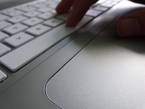 working on a laptop computer