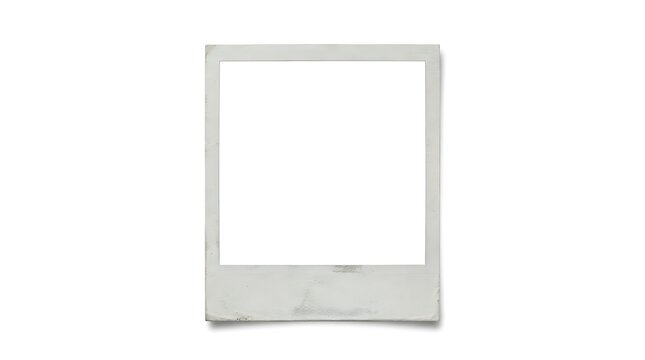 A blank weathered instant camera film frame isolated on a plain white background surface with space positioned against worn vintage instant