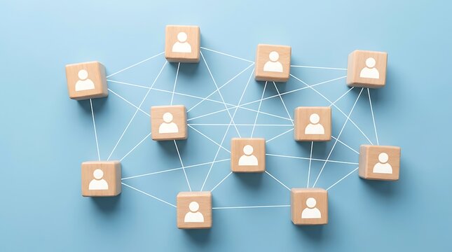 Wooden blocks with human icons connected by white lines on a blue background surface with lines representing network icons linked together
