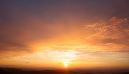 Fototapeta premium Beautiful Sunset Sky Background With Soft Pastel Orange Light And Dramatic Golden Sun Glow For Panoramic Travel Mockup Design