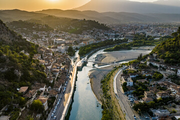 Fototapeta premium Oblique Aerial View of a Historic River City in a Mountain Valley in Berat, Albania