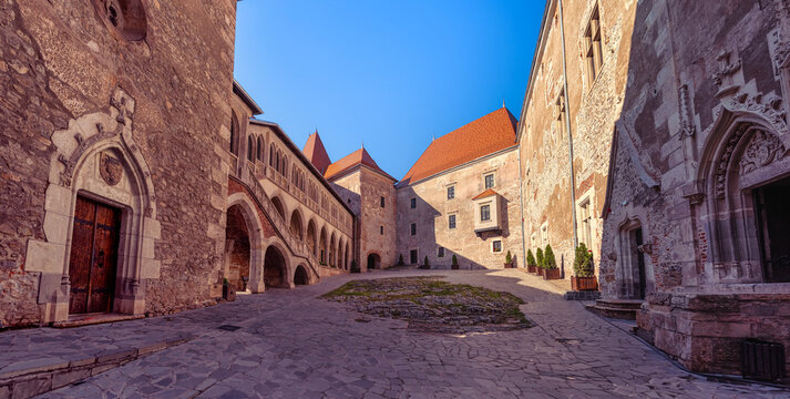 Wide view of the inner courtyard and arcaded gallery at Corvin Castle in Hunedoara Romania