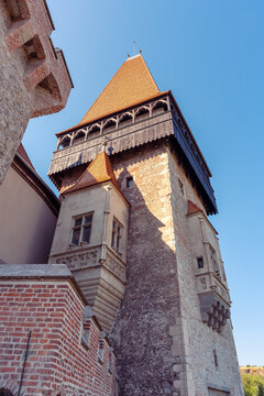 Low angle view of the main tower and stone walls at Corvin Castle in Hunedoara Romania