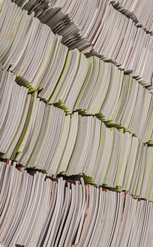 Pile of school notebooks on shelf