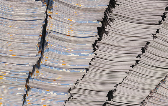 Pile of school notebooks on shelf