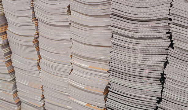 Pile of school notebooks on shelf