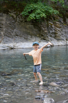 The Child Spends Time In Nature