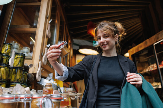 Woman shopping for artisan food products at market