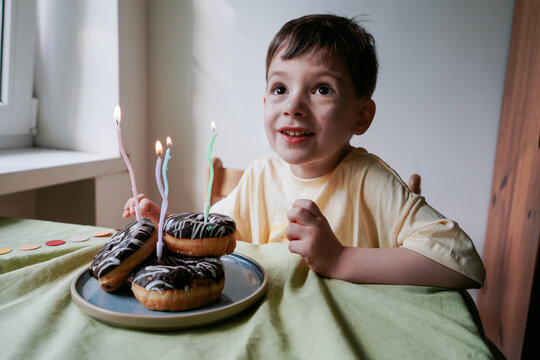 A Little Boy Celebrates His Birthday In A Homey Atmosphere