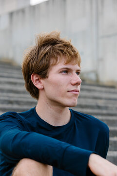 Portrait of a man in athletic wear looking at horizon with confidence