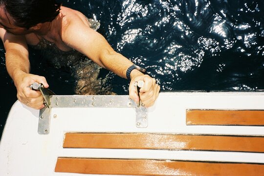 Man Climbing From Sea