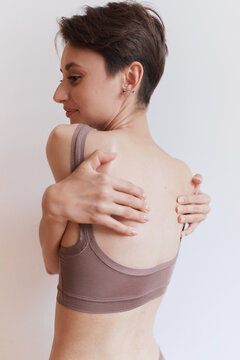 Woman Embracing Herself with Self Love