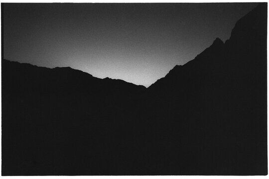 Silhouette of mountains against dusk sky