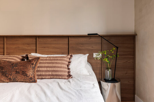 Modern bed corner with plant vase