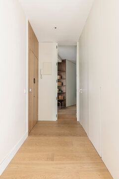 Corridor with white built in storage
