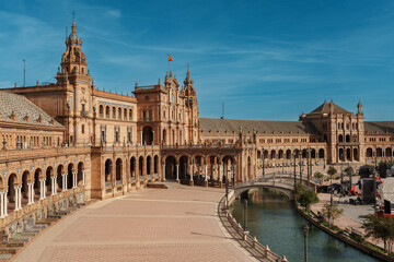 Panoramic view of Plaza de Espana with canal, bridge, and tower in Seville © Puripat
