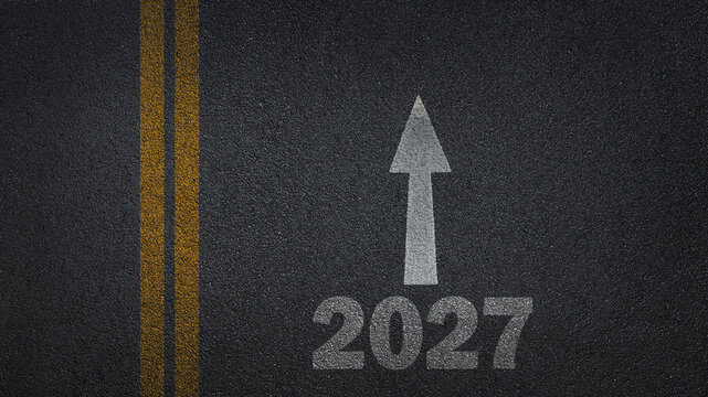  Vision 2027 on asphalt road ground. Business Target for 2027, Financial Goals and Business Strategy with arrow. Top view.
