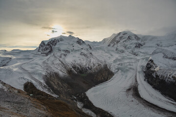 Obraz premium Gornergrat Zermatt Switzerland, sunrise at Monte Rosa peak and Alps mountain range in winter