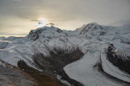 Gornergrat Zermatt Switzerland, sunrise at Monte Rosa peak and Alps mountain range in winter