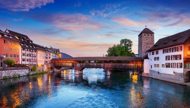 historic cityscape with covered bridge over water at dusk