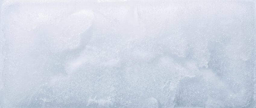 Abstract texture of solid dry ice block. Frozen carbon dioxide with crystal structures and frost. Cold background