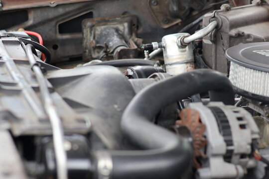 Close-up of V8 Car Engine with Round Air Cleaner and Alternator