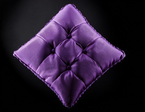 purple diamond shaped textile with tufts on black background