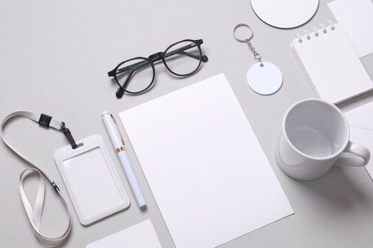 Corporate identity, set of white blank promotional products for business on a gray background. Flat lay. Creative mockup for your brand design.