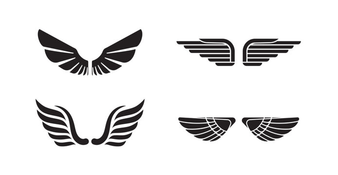 Collection of stylized symmetrical wing emblems and abstract feather symbols in black, vector illustration