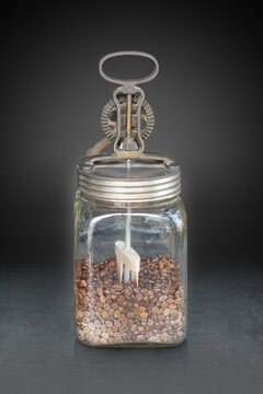 front view antique manual  repurposed or stored with coffee beans in glass cup on grey marble floor, black and grey background, object, decor, keep, coffee, copy space