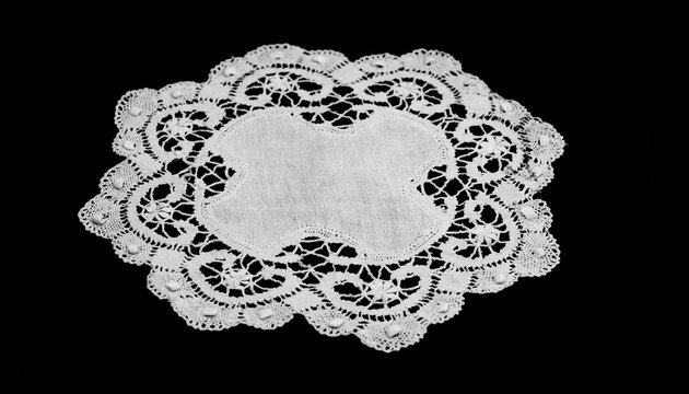 Antique lace napkin, doily, bobbin needle lace isolated on black background, bobbin lace with gimp trim, vintage textile design, antique fabric art. Needle work