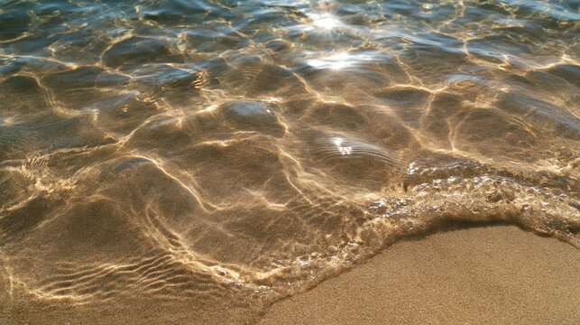 Crystal Clear Water Flowing Over Golden Sand Beach