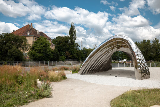 Wroclaw, Poland - July 10, 2026: Oskar Zieta&rsquo;s NAWA installation forms a sequence of mirror-polished stainless steel arches across landscaped Daliowa Island.