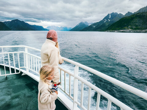 Mother and daughter on ferry deck in Norway enjoying fjord scenery family cruise vacation maritime travel lifestyle tourism, parent and kid passengers on Arctic tour voyage by ship bonding moments