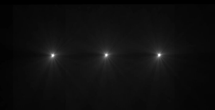Abstract loop center glow multicolored star optical lens flares shine light animation on black background. 4K dynamic kinetic bright star light rays ..`