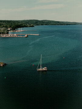 Aerial view of a sailboat by a marina, Suttons Bay, Michigan, USA