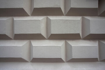 Biała ściana o oryginalnym wzorze - kostka, pudełka, prostokąty, wrażenie 3d. A white wall with a unique pattern—cubes, boxes, and a 3D effect. © 123108 Aneta