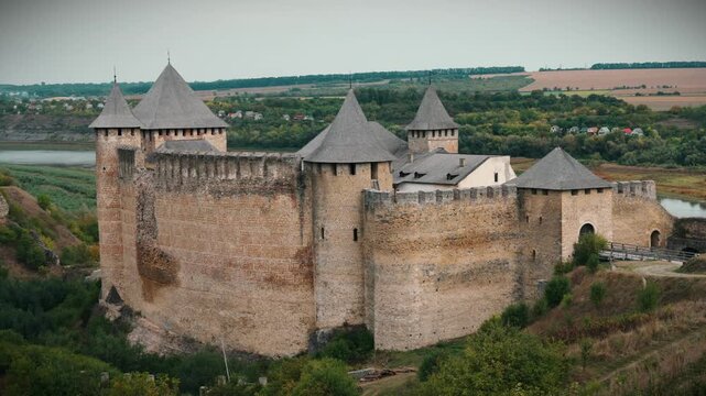 KHOTYN, UKRAINE - SEPTEMBER 11, 2026: Aerial view of Khotyn Fortress with its stone towers and defensive walls overlooking the Dniester River