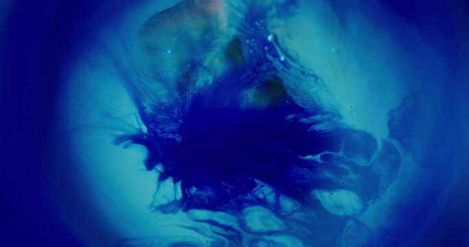 Blue paint. Blur bright splash. Vibrant color circle glitter water texture round acrylic fluid spill on abstract acrylic art background.